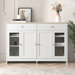 Sideboards>Skänk med vit trästruktur, fyra dörrar, två lådor, dörr med glas. Vardagsrum, matsal. Träfärg och vit