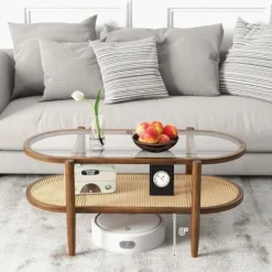 COSTWAY Soffbord>Soffbord med 2 nivåer , Ovalt träsoffbord med hylla i PE-rotang, Tempererat glasbordsskiva, 102 x 56 x 47 cm